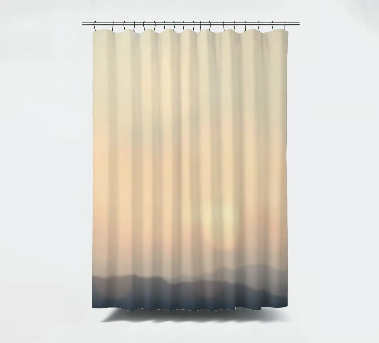Sunset casting a warm glow over distant mountains and cloude shower curtain by DesignDoodle