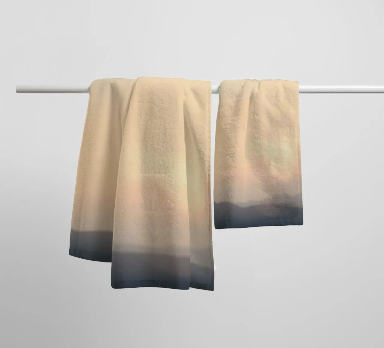 Sunset casting a warm glow over distant mountains and cloude towel by DesignDoodle