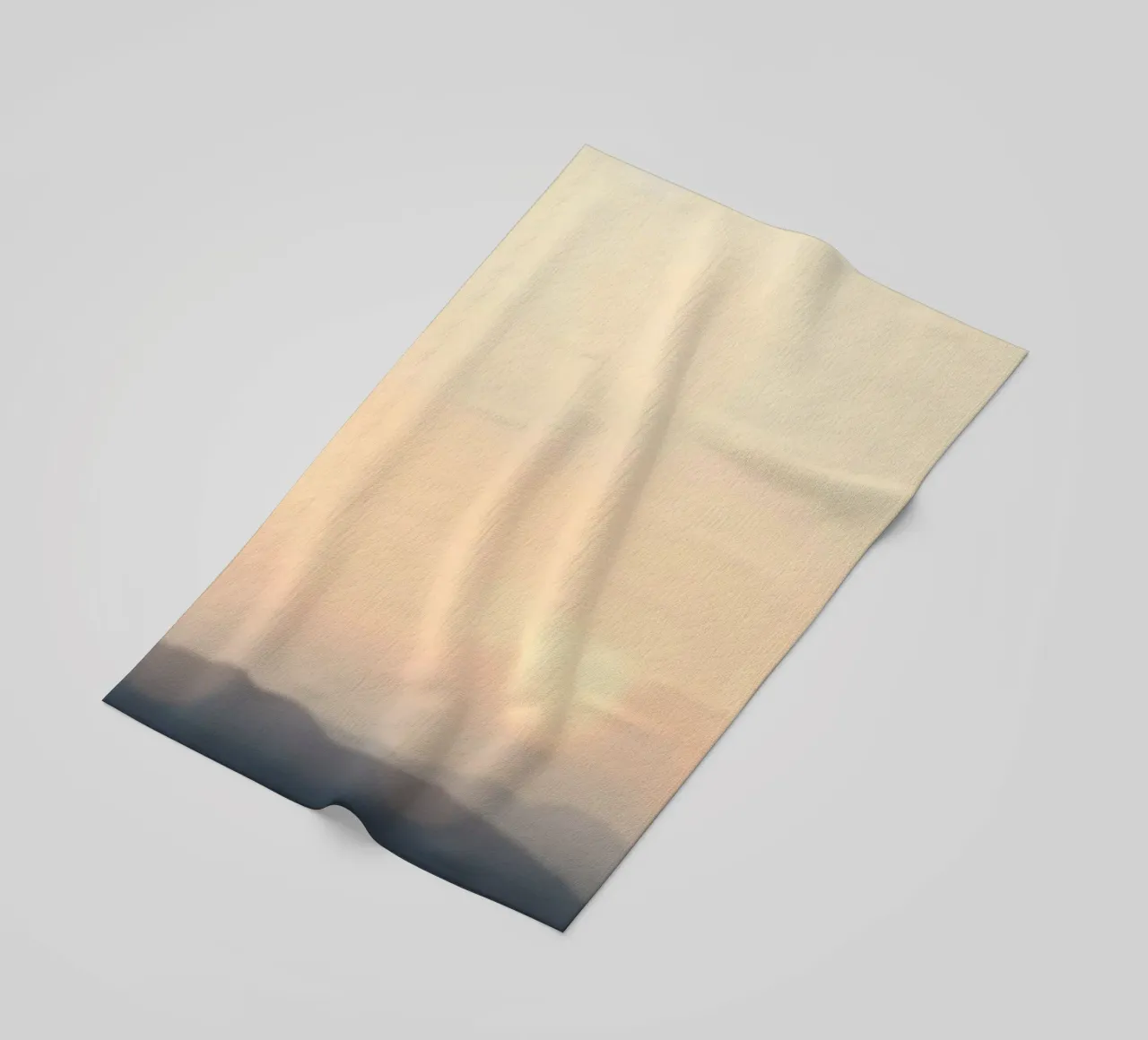 Sunset casting a warm glow over distant mountains and cloude beach towel by DesignDoodle