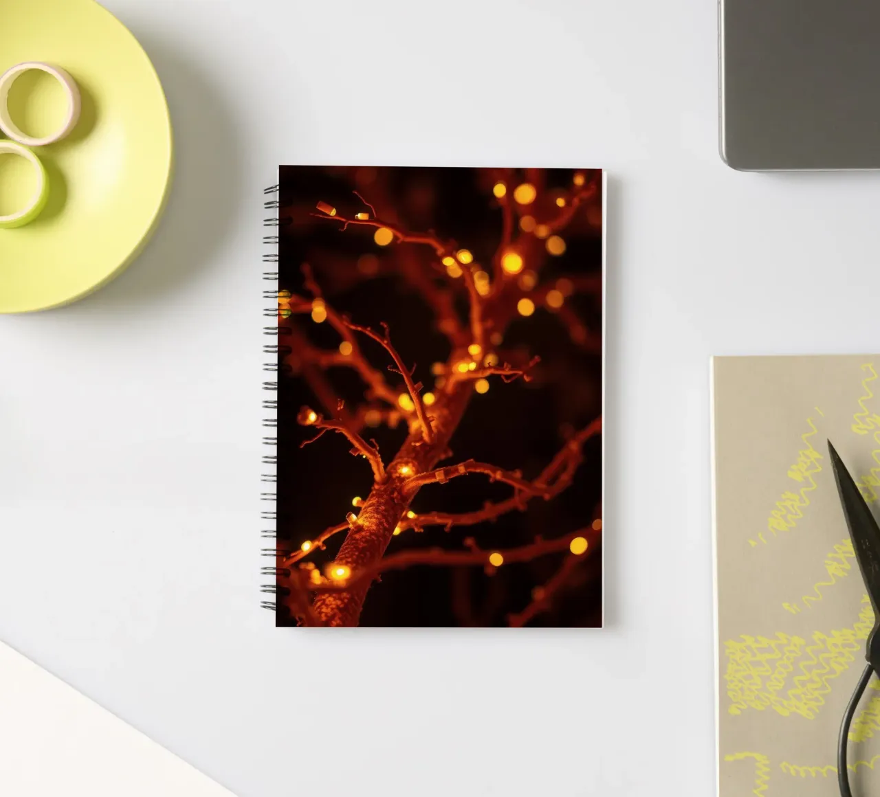 Twinkling warm lights on a tree branch create cozy ambience spiral notebook by DesignDoodle