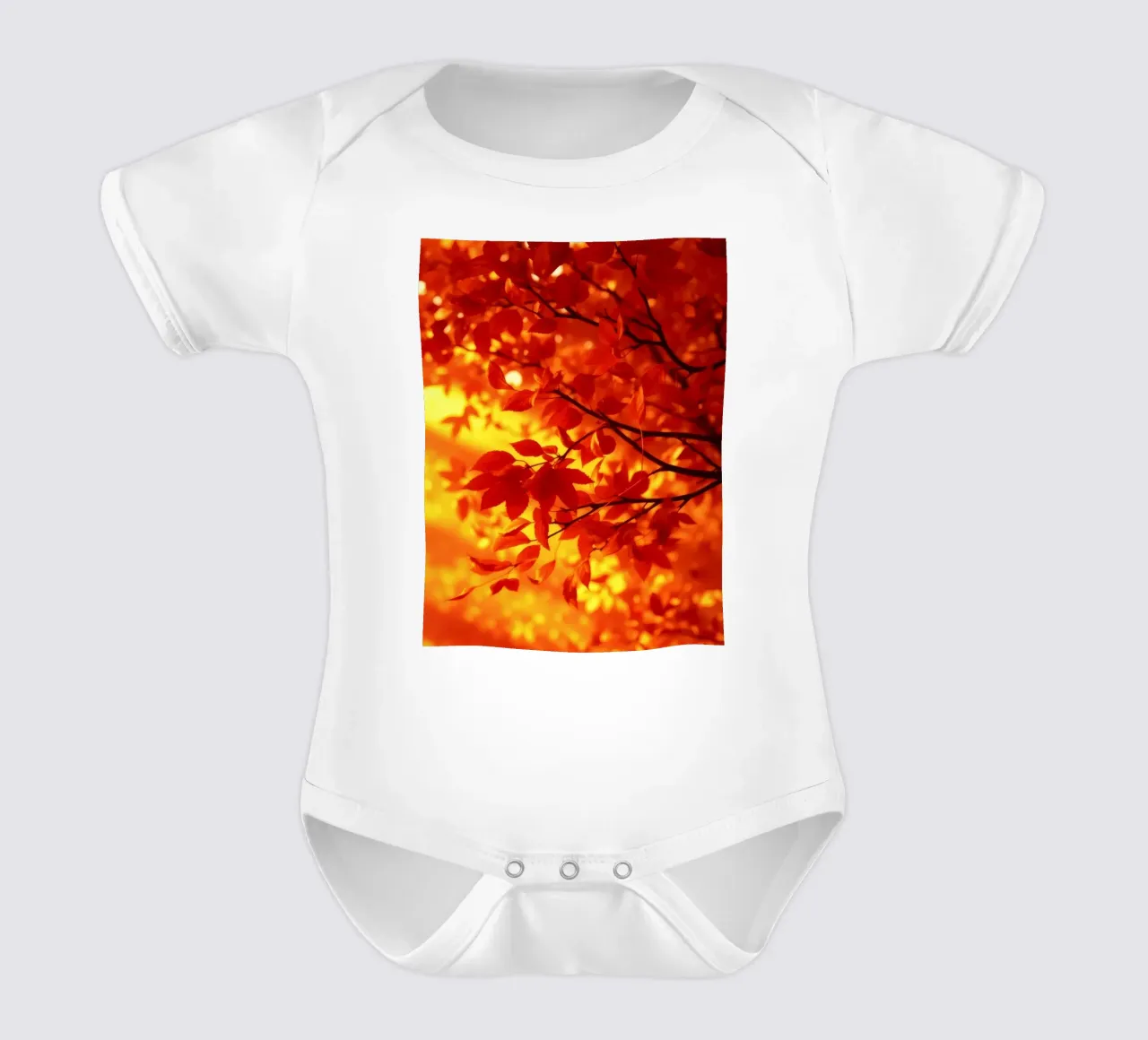 Vibrant autumn leaves illuminated against a warm background short-sleeve baby romper by DesignDoodle