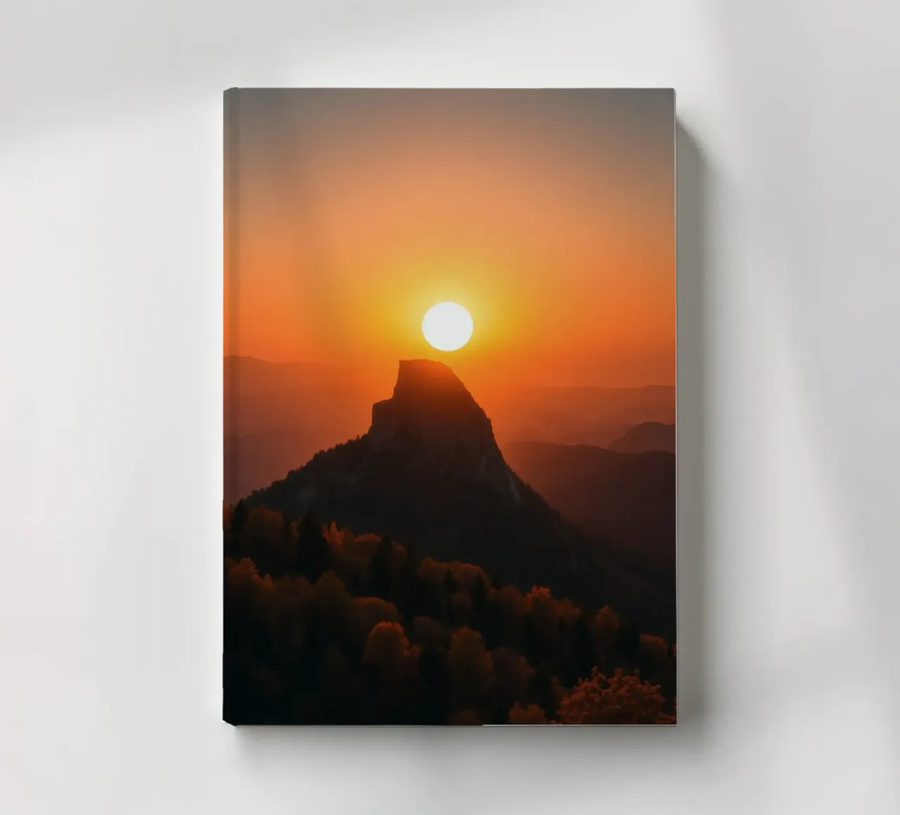 Sunset over a mountain peak with vibrant colors notebook by DesignDoodle