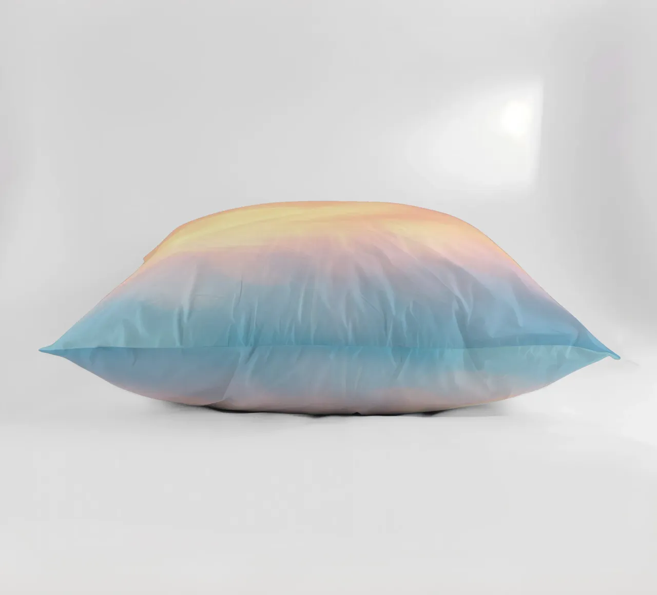 Soft pastel gradient background blending warm pinks and cool decorative cushion by DesignDoodle
