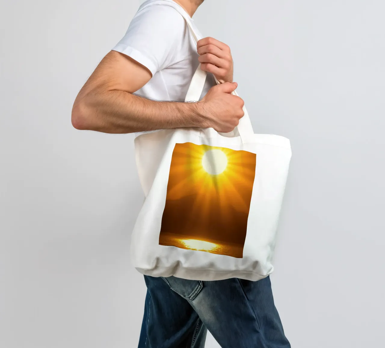 Bright sun against calm waters creating a stunning abstract tote bag by DesignDoodle