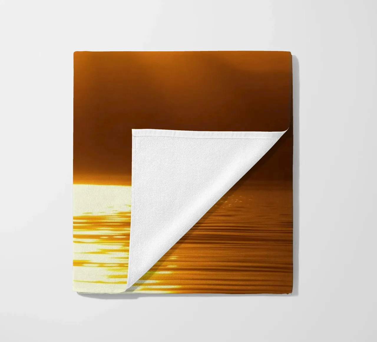 Bright sun against calm waters creating a stunning abstract beach towel by DesignDoodle
