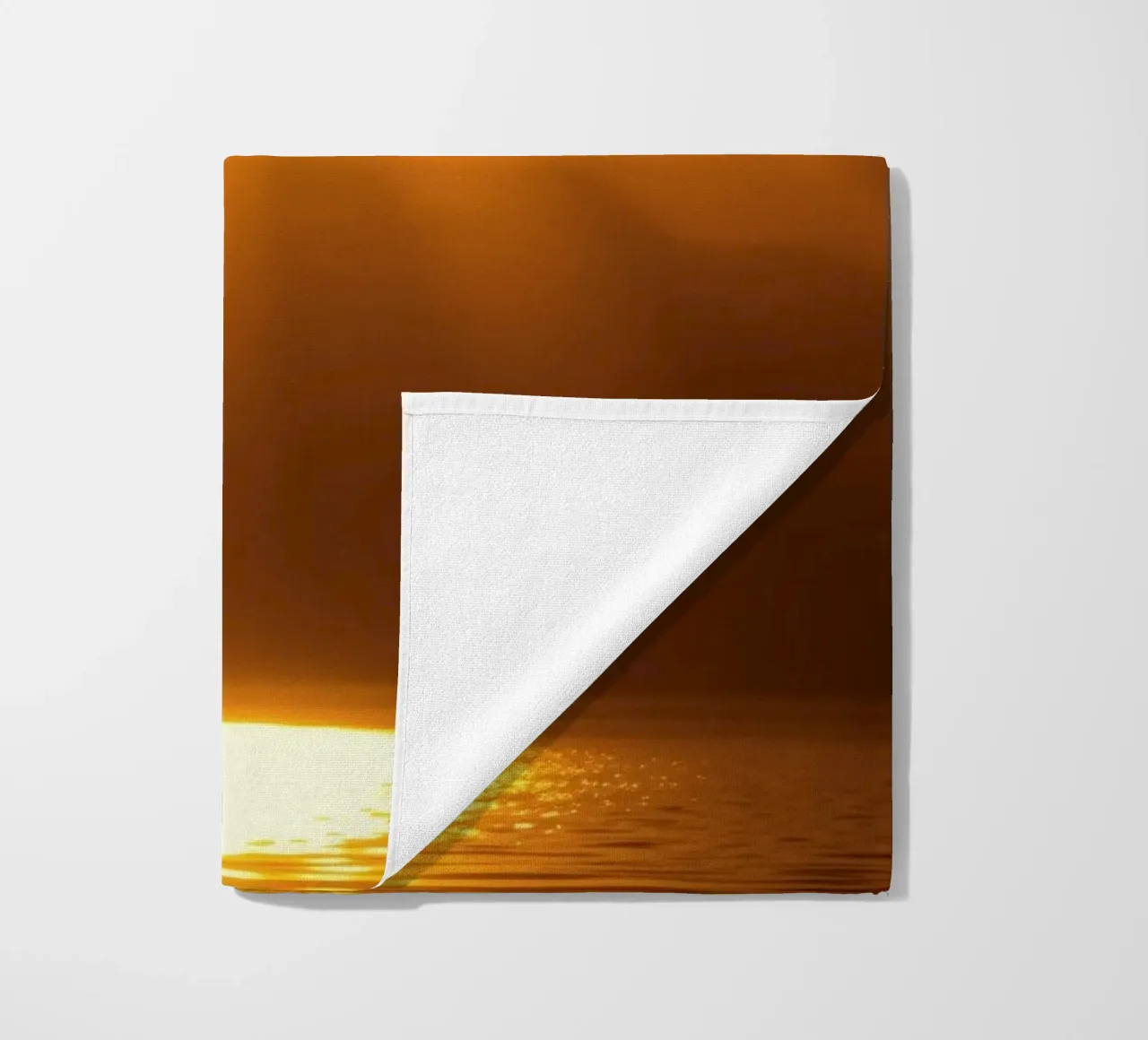 Bright sun against calm waters creating a stunning abstract beach towel by DesignDoodle