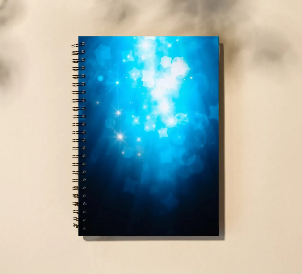 Bright blue abstract background design with sparkling effect spiral notebook by DesignDoodle