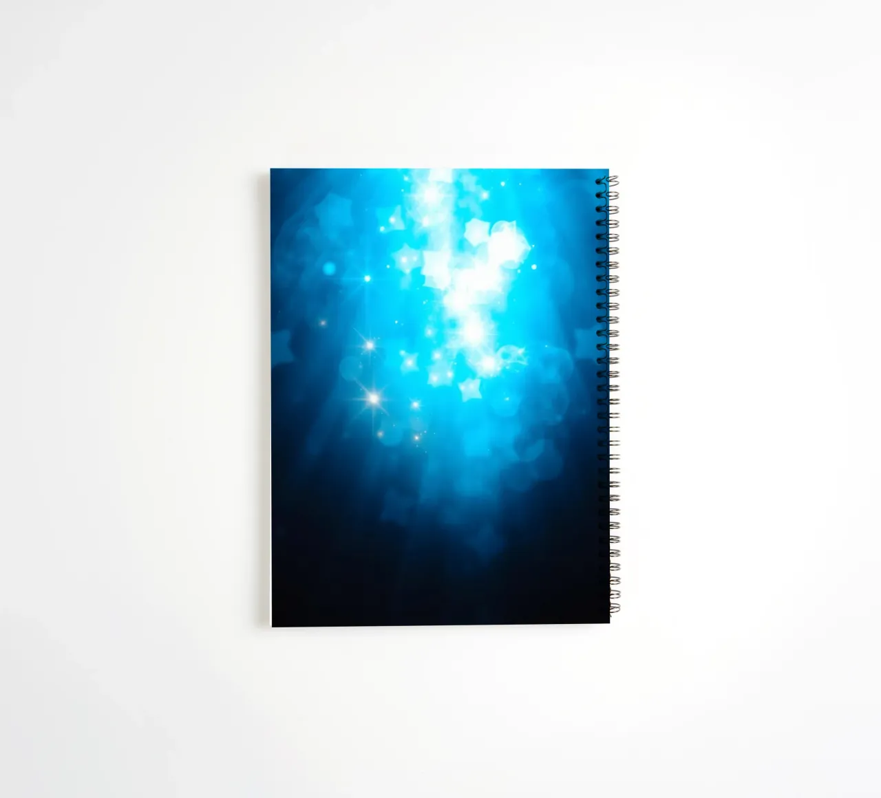 Bright blue abstract background design with sparkling effect spiral notebook by DesignDoodle