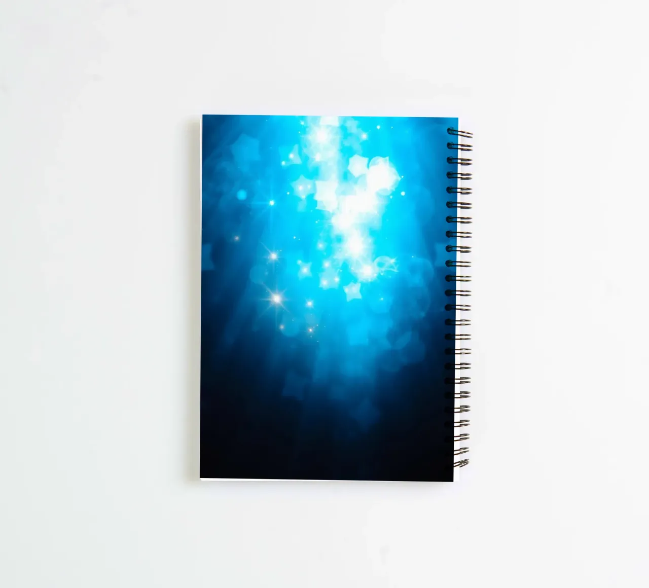 Bright blue abstract background design with sparkling effect spiral notebook by DesignDoodle