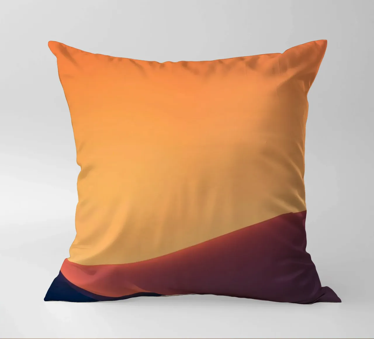 smooth hills under a gradient sunset sky with warm orange decorative cushion by DesignDoodle