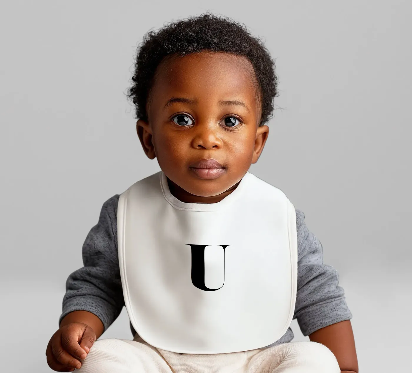 U baby bib by Mottos by Sinan Saydik