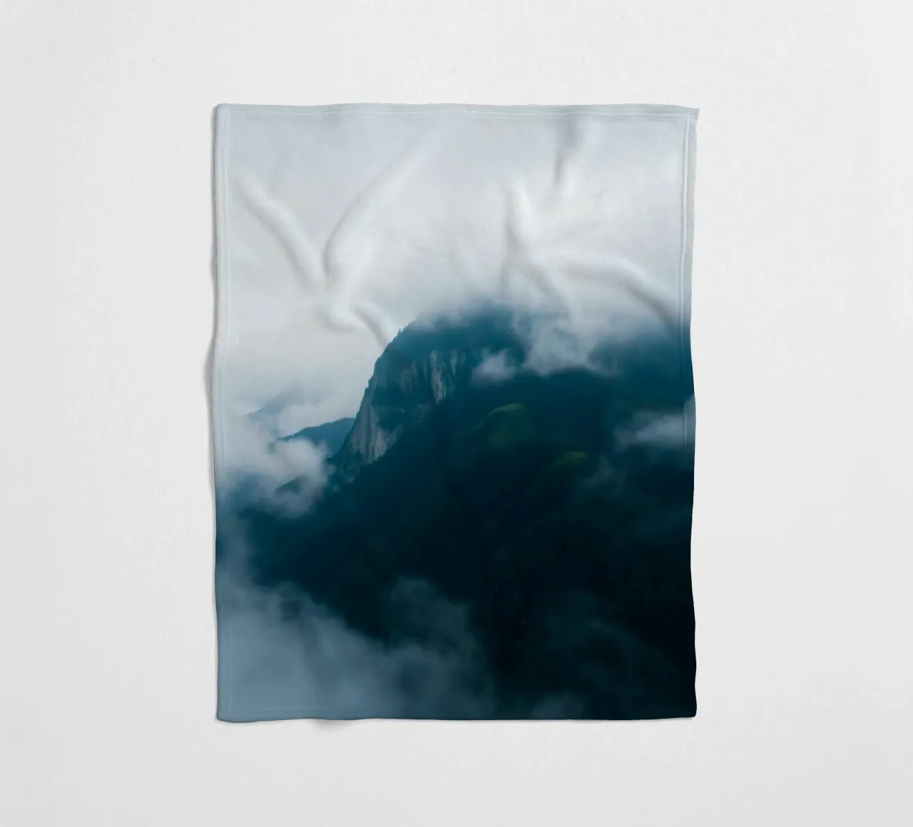Mystical mountain ranges shrouded in fog fleece blanket by DesignDoodle