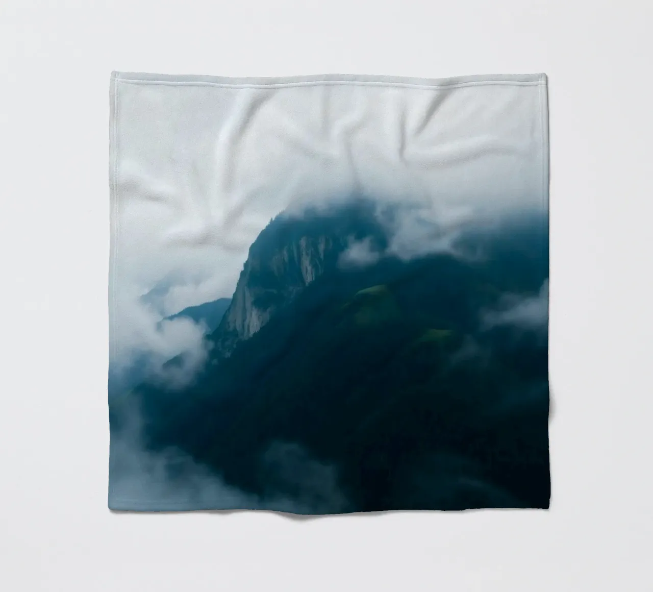 Mystical mountain ranges shrouded in fog fleece blanket by DesignDoodle