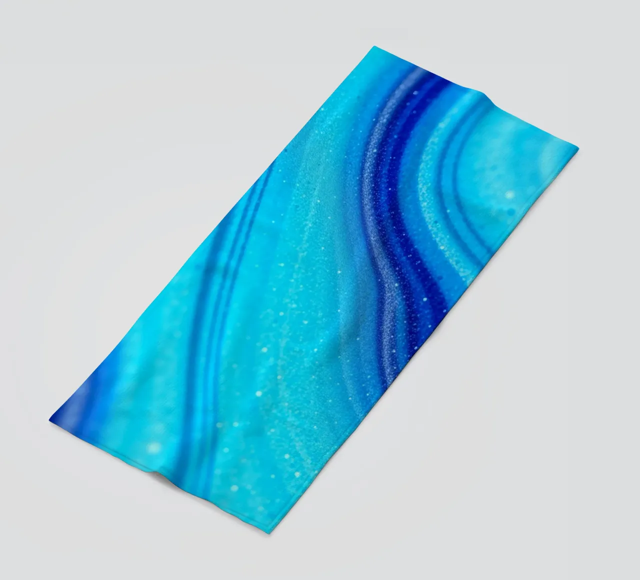 Vibrant abstract flowing blue waves and shimmering elements beach towel by DesignDoodle