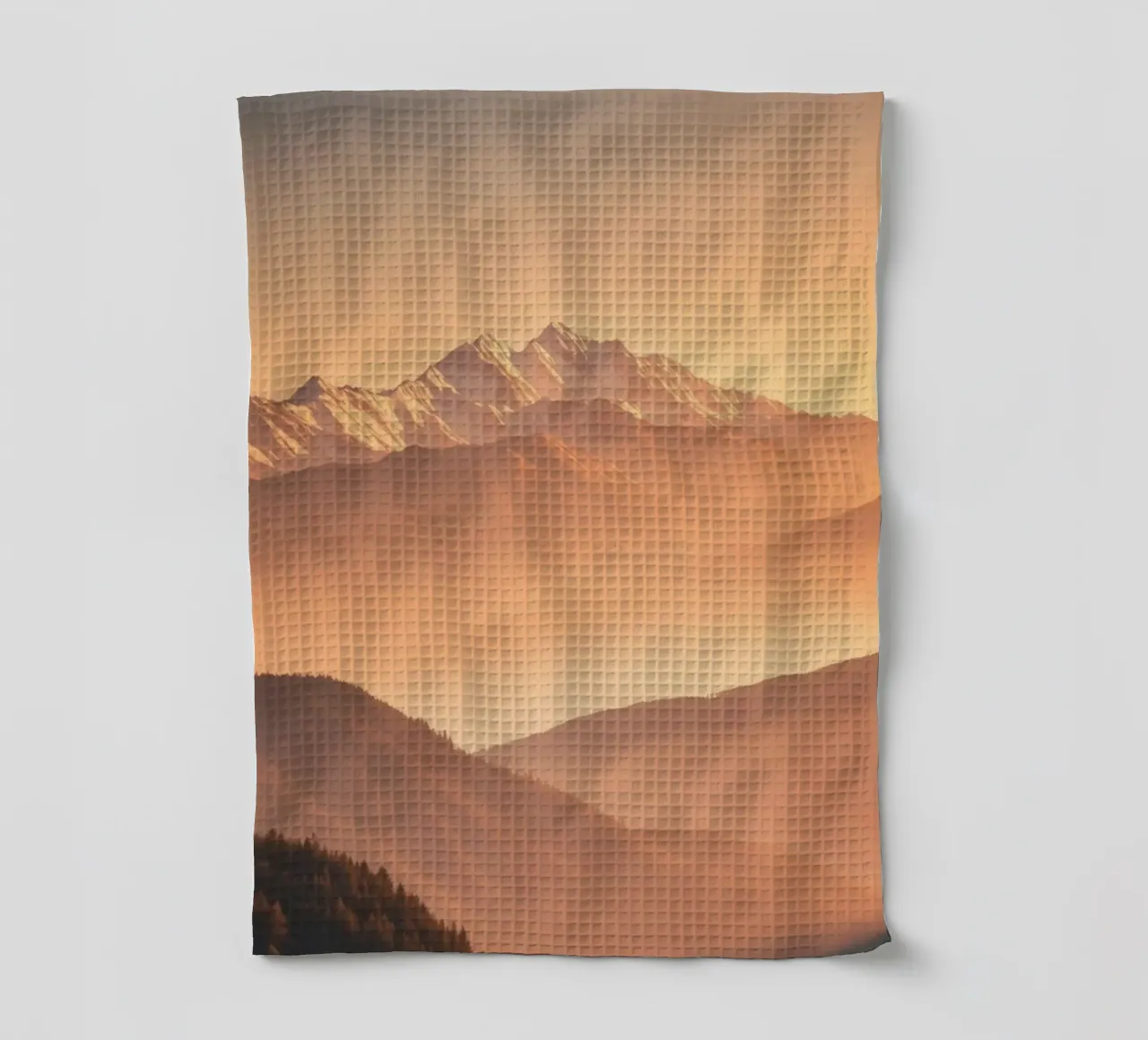 Majestic mountains shrouded in mist during golden hour tea towel by DesignDoodle