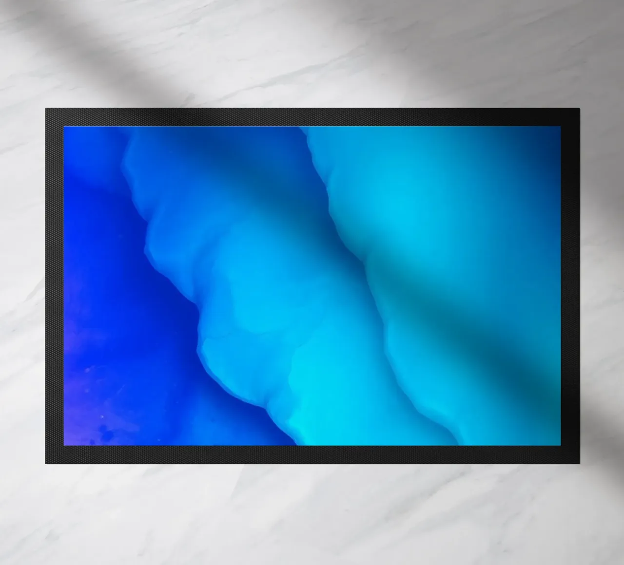 Vibrant blue abstract design for featuring smooth swirls doormat by DesignDoodle