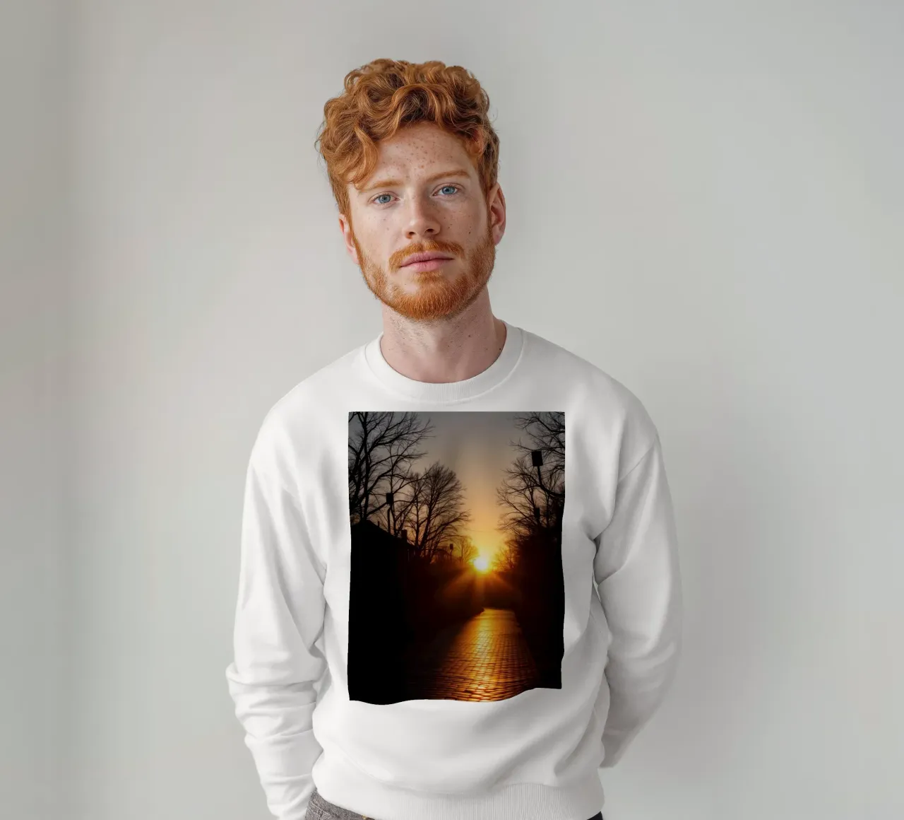 Sunset view along a tree-lined pathway with warm hues sweatshirt by DesignDoodle