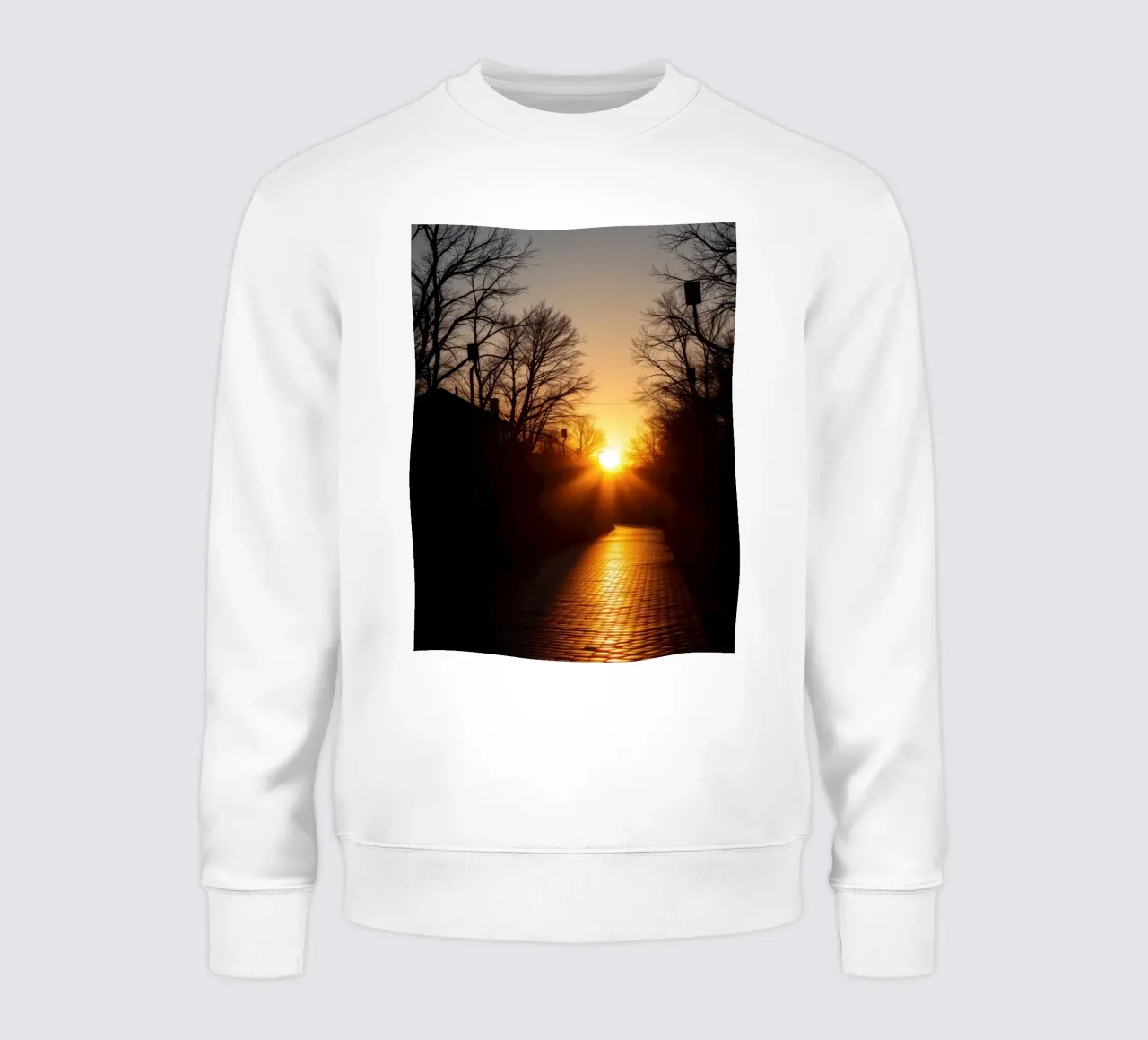 Sunset view along a tree-lined pathway with warm hues sweatshirt by DesignDoodle