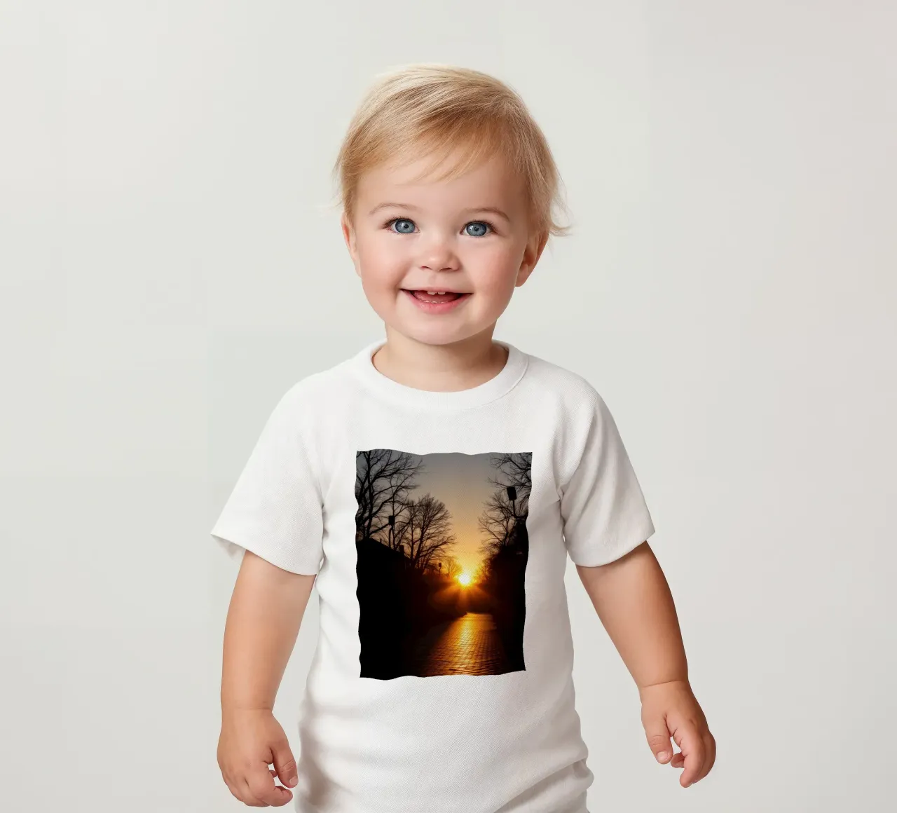 Sunset view along a tree-lined pathway with warm hues baby t-shirt by DesignDoodle