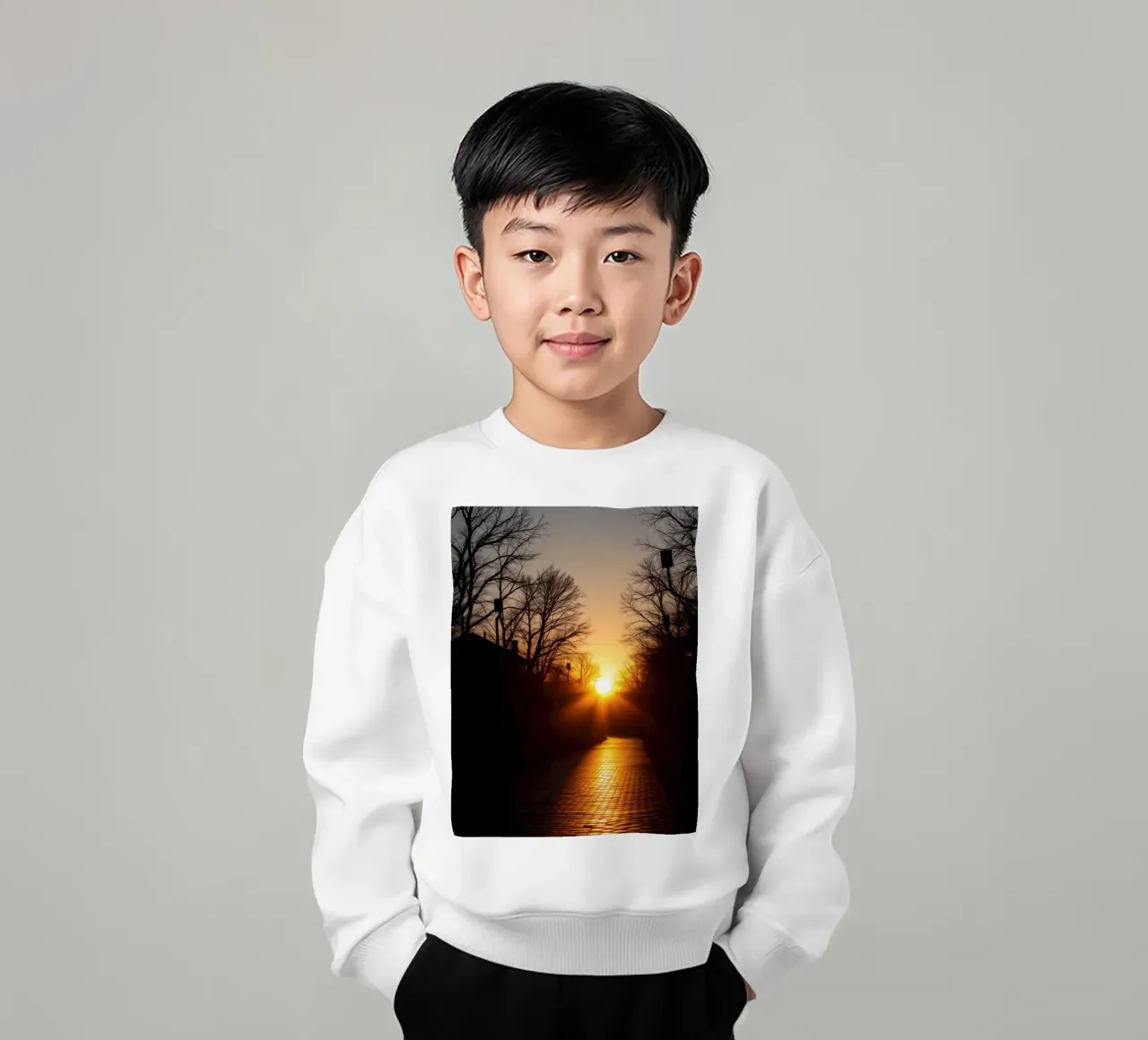Sunset view along a tree-lined pathway with warm hues kids sweatshirt by DesignDoodle