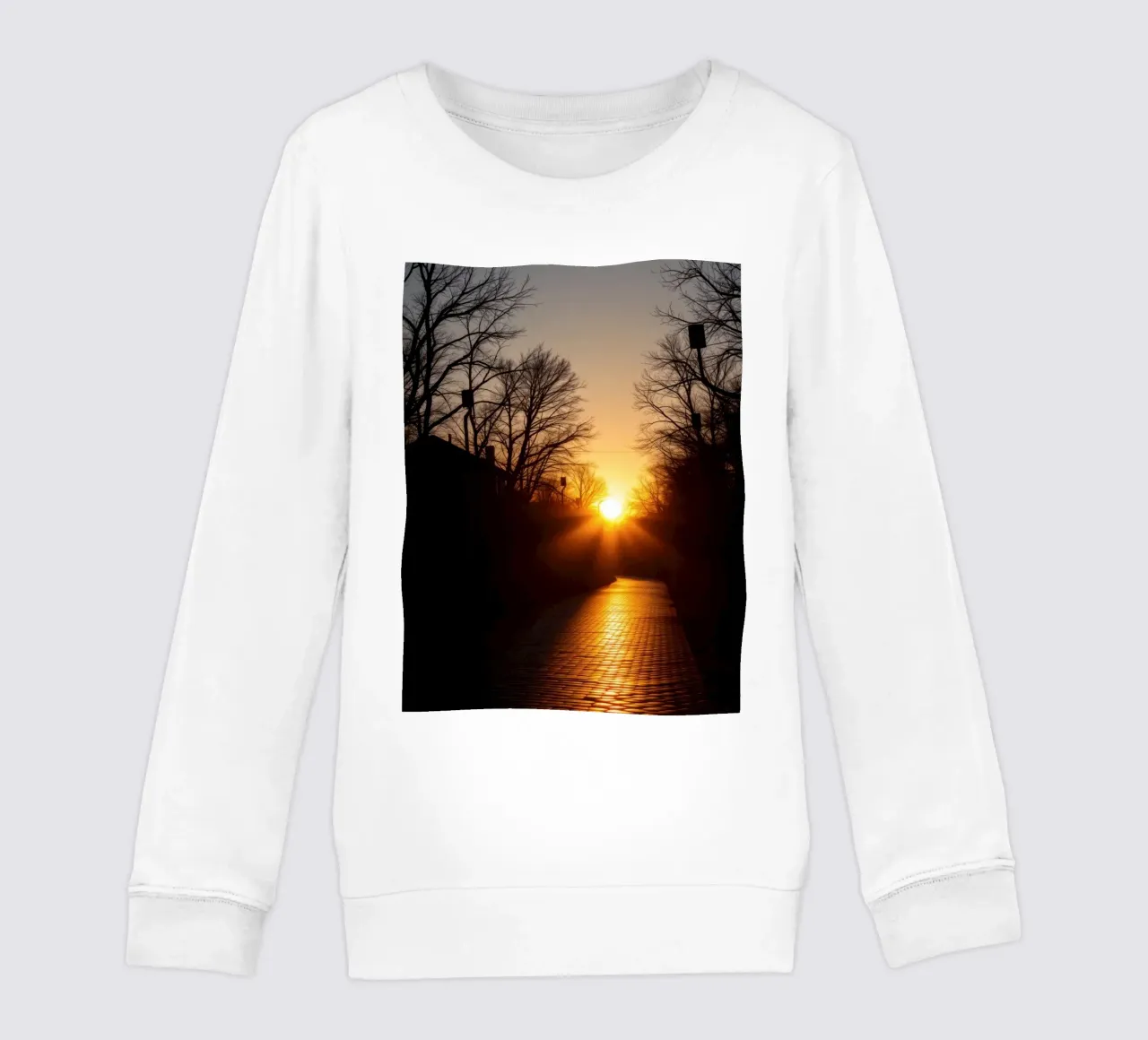 Sunset view along a tree-lined pathway with warm hues kids sweatshirt by DesignDoodle