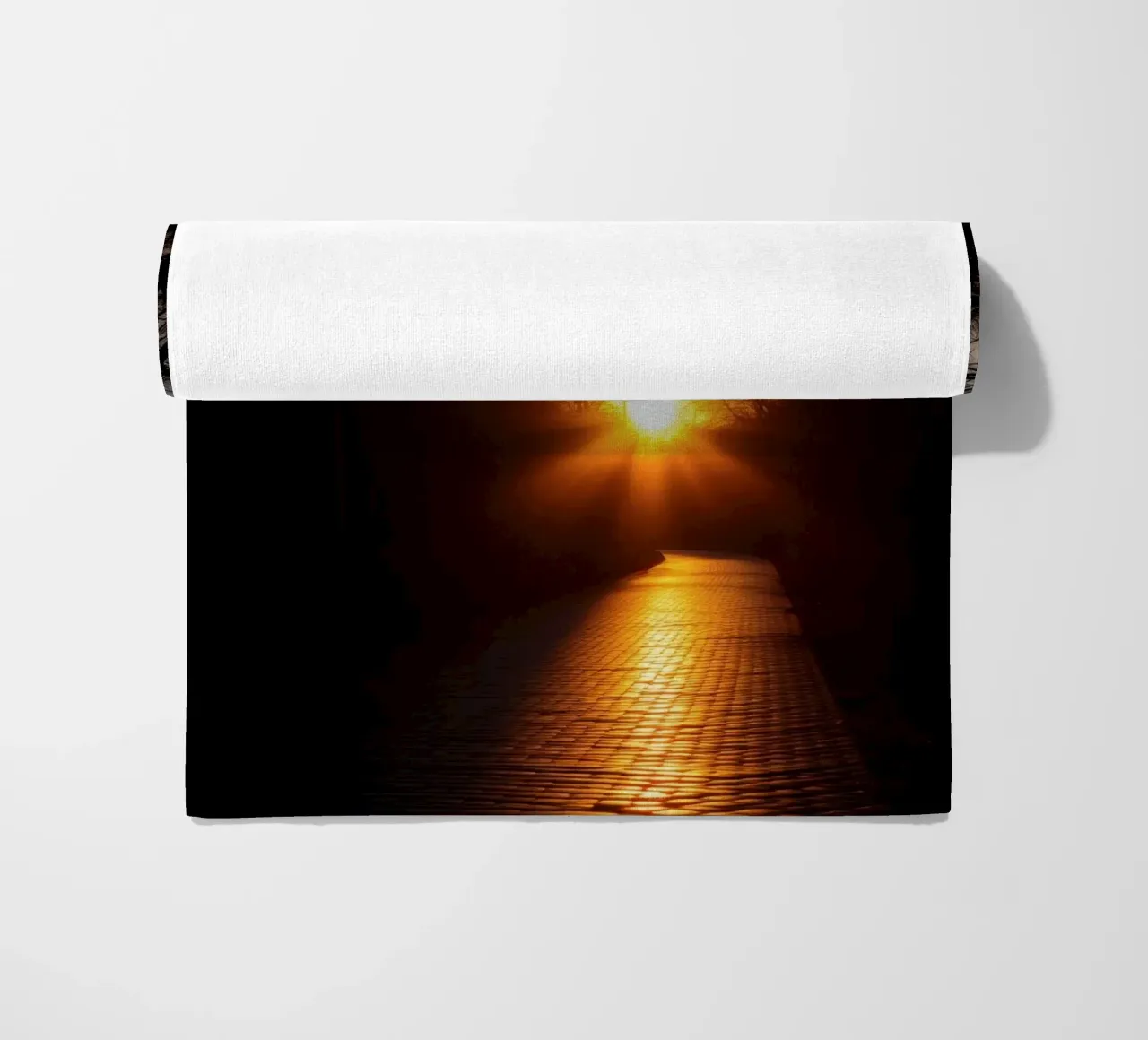 Sunset view along a tree-lined pathway with warm hues beach towel by DesignDoodle