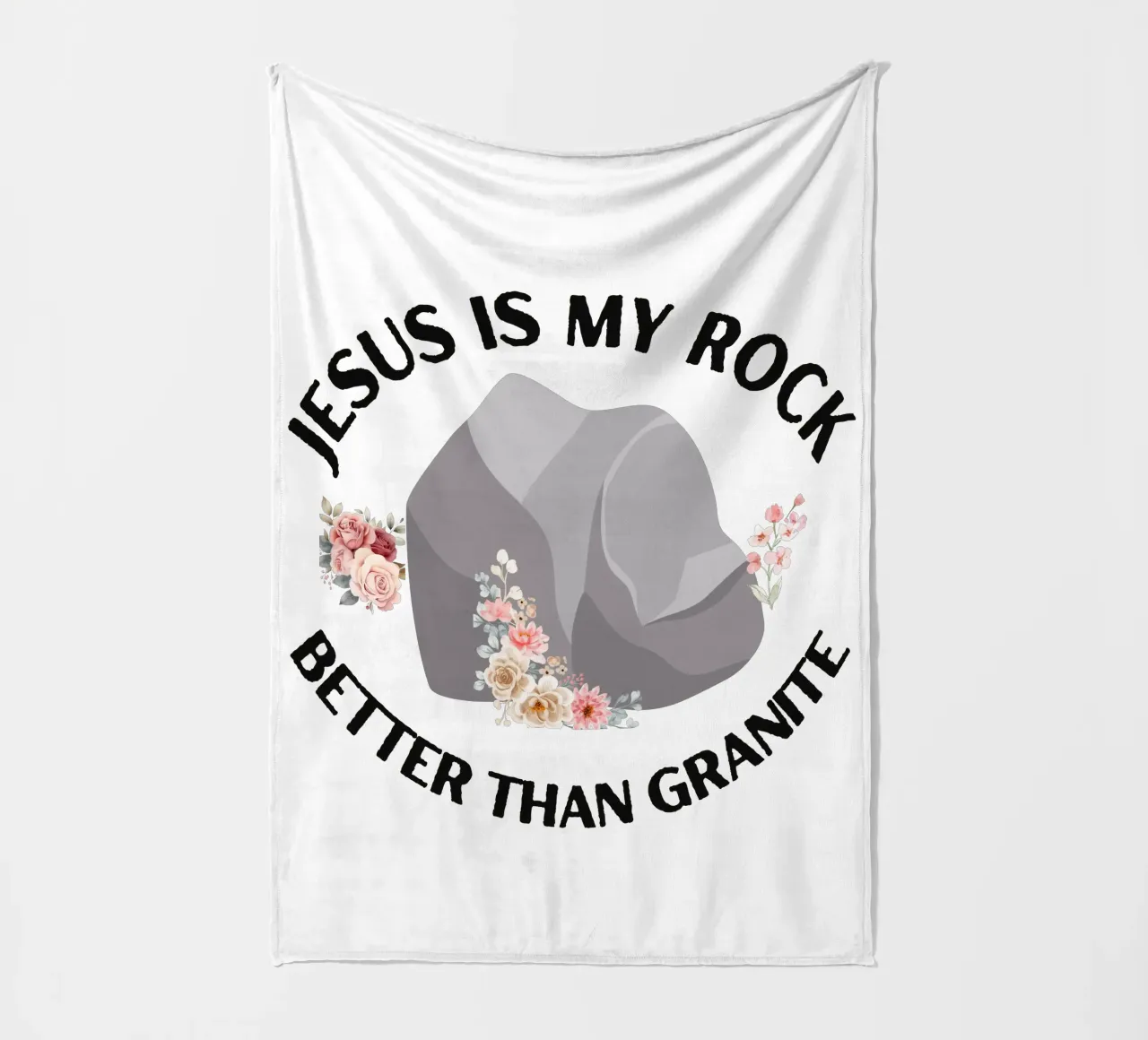 Rocks may be tough, but cannot compare to strength of Jesus fleece blanket by Lionandlamb