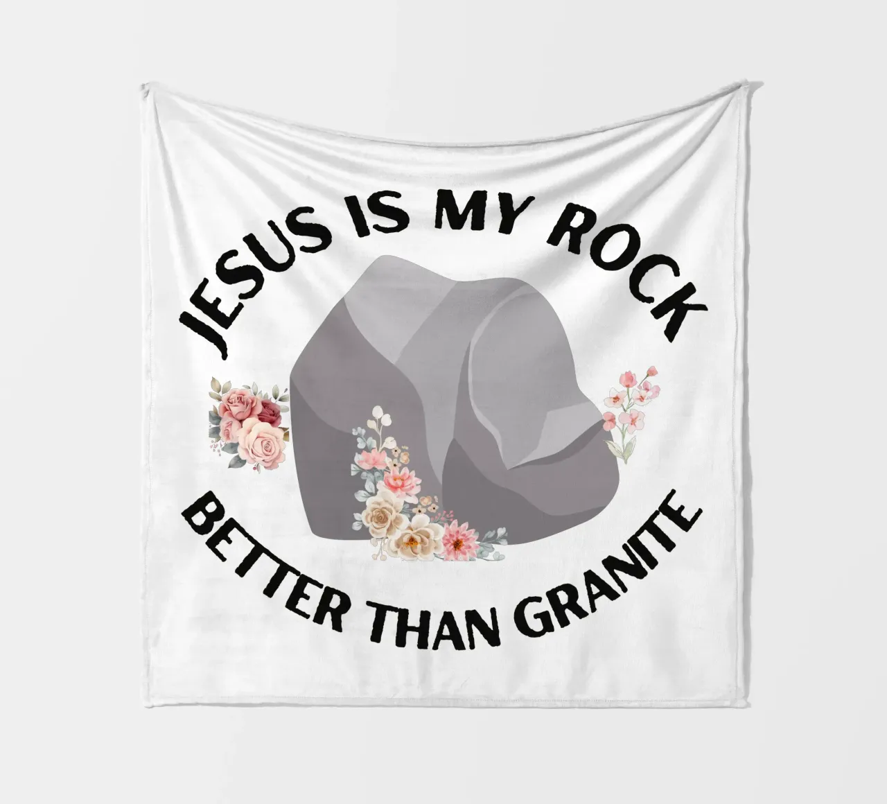 Rocks may be tough, but cannot compare to strength of Jesus fleece blanket by Lionandlamb