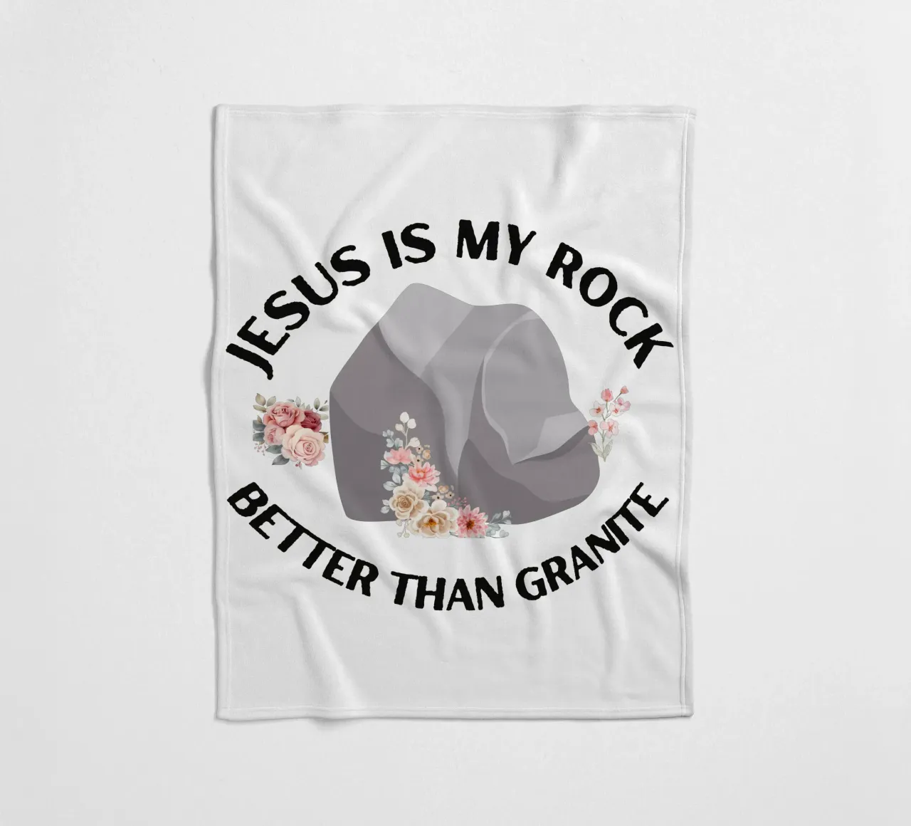 Rocks may be tough, but cannot compare to strength of Jesus fleece blanket by Lionandlamb