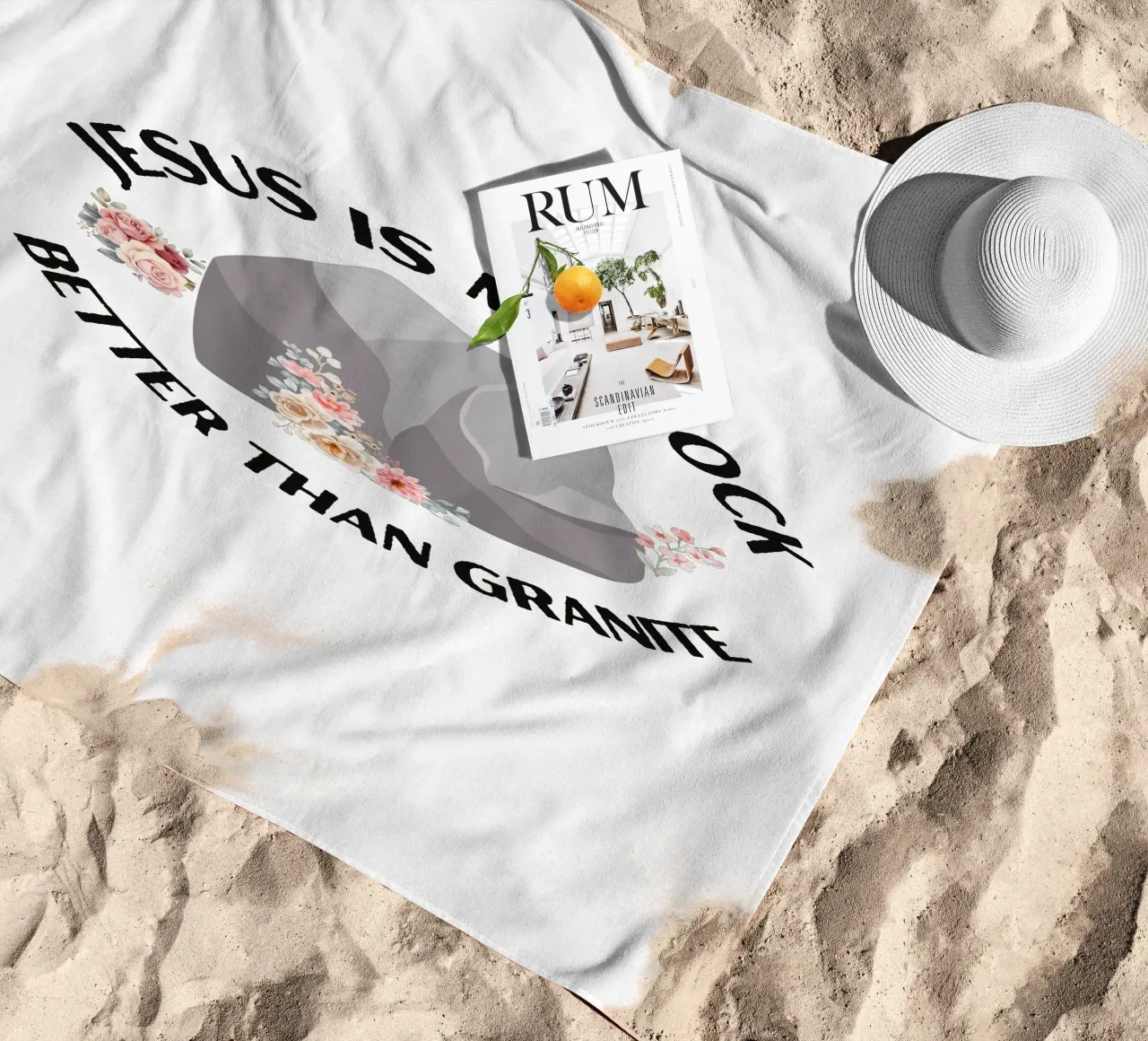Rocks may be tough, but cannot compare to strength of Jesus beach towel by Lionandlamb