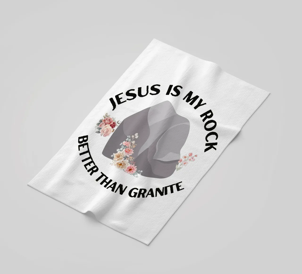 Rocks may be tough, but cannot compare to strength of Jesus beach towel by Lionandlamb