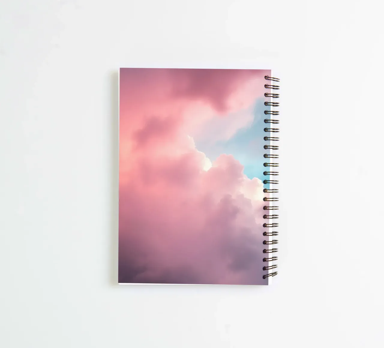Vibrant cloud formations create a stunning abstract spiral notebook by DesignDoodle