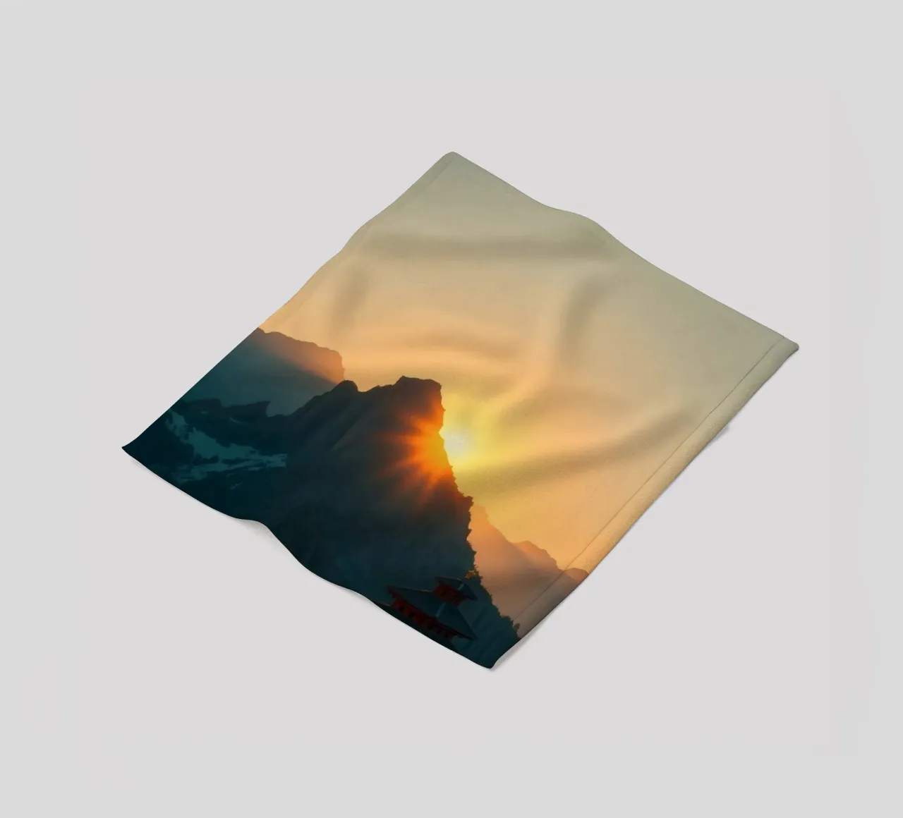 Sunset view over mountains with traditional structure fleece blanket by DesignDoodle
