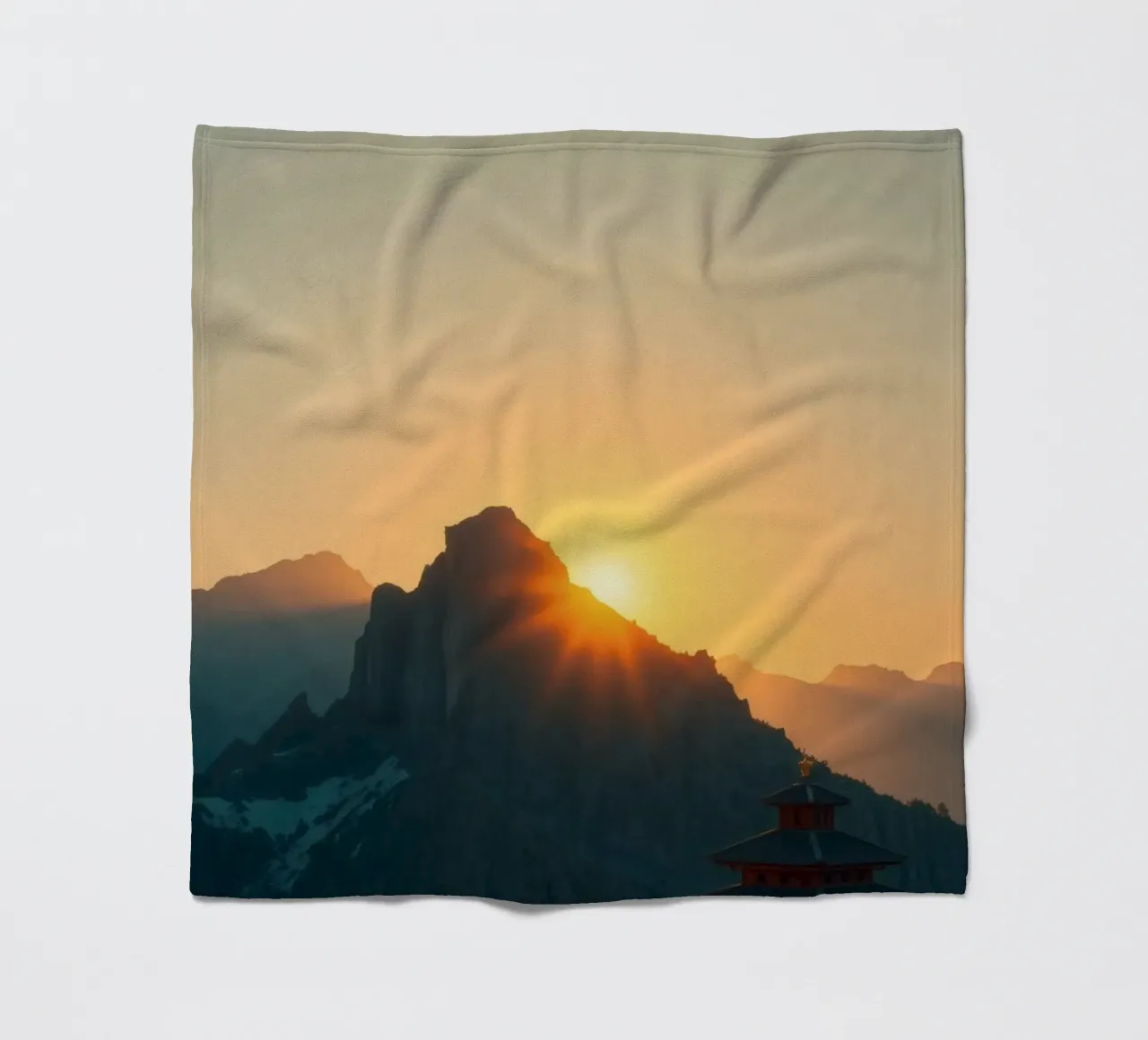 Sunset view over mountains with traditional structure fleece blanket by DesignDoodle