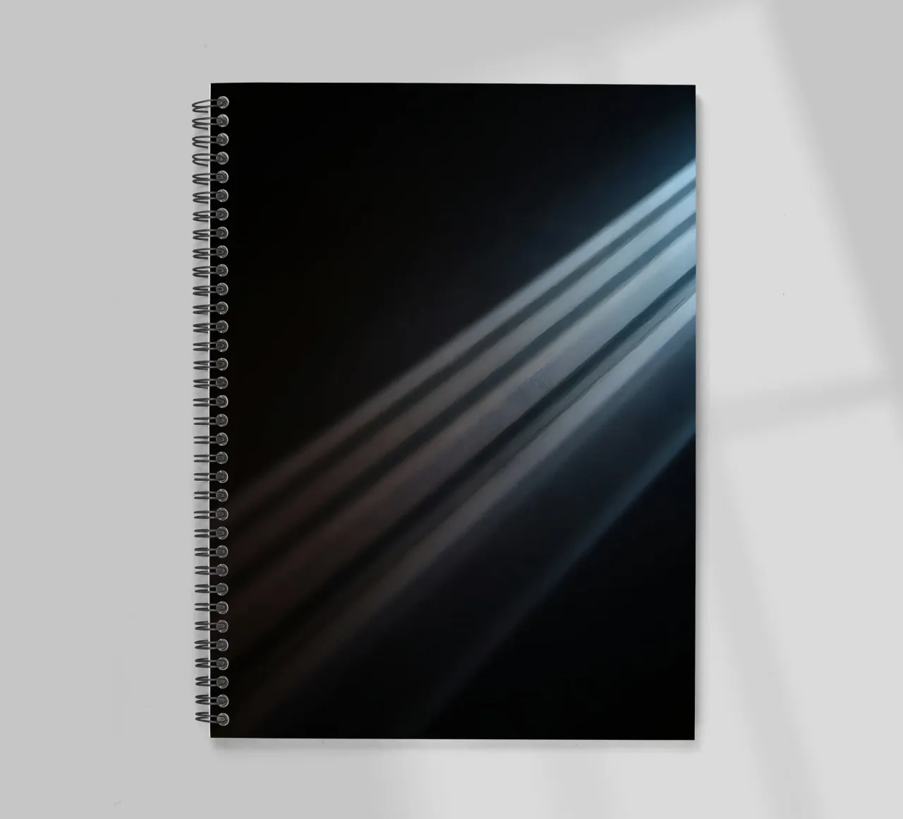 Elegant abstract light beams creating a serene wallpaper spiral notebook by DesignDoodle