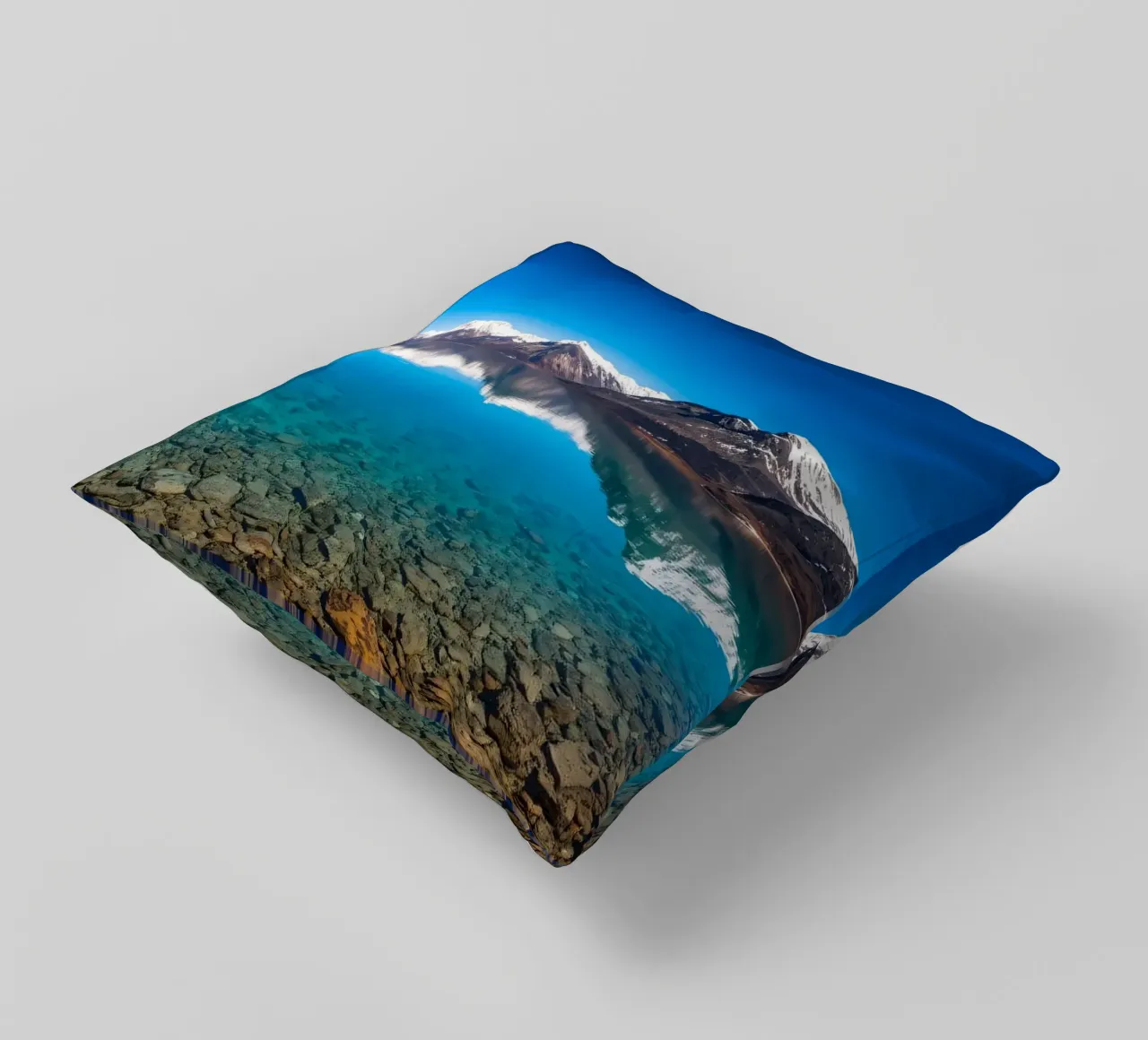 view of a serene lake surrounded by snow-capped mountains decorative cushion by DesignDoodle