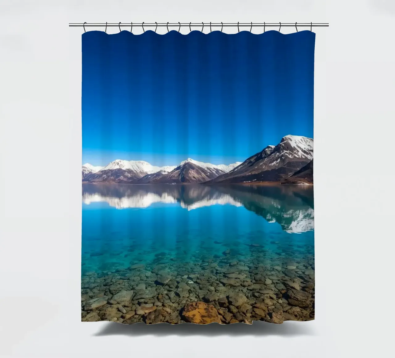 view of a serene lake surrounded by snow-capped mountains shower curtain by DesignDoodle
