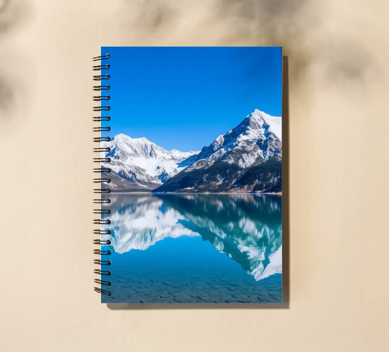 Stunning reflection of snow-capped mountains in a tranquil spiral notebook by DesignDoodle