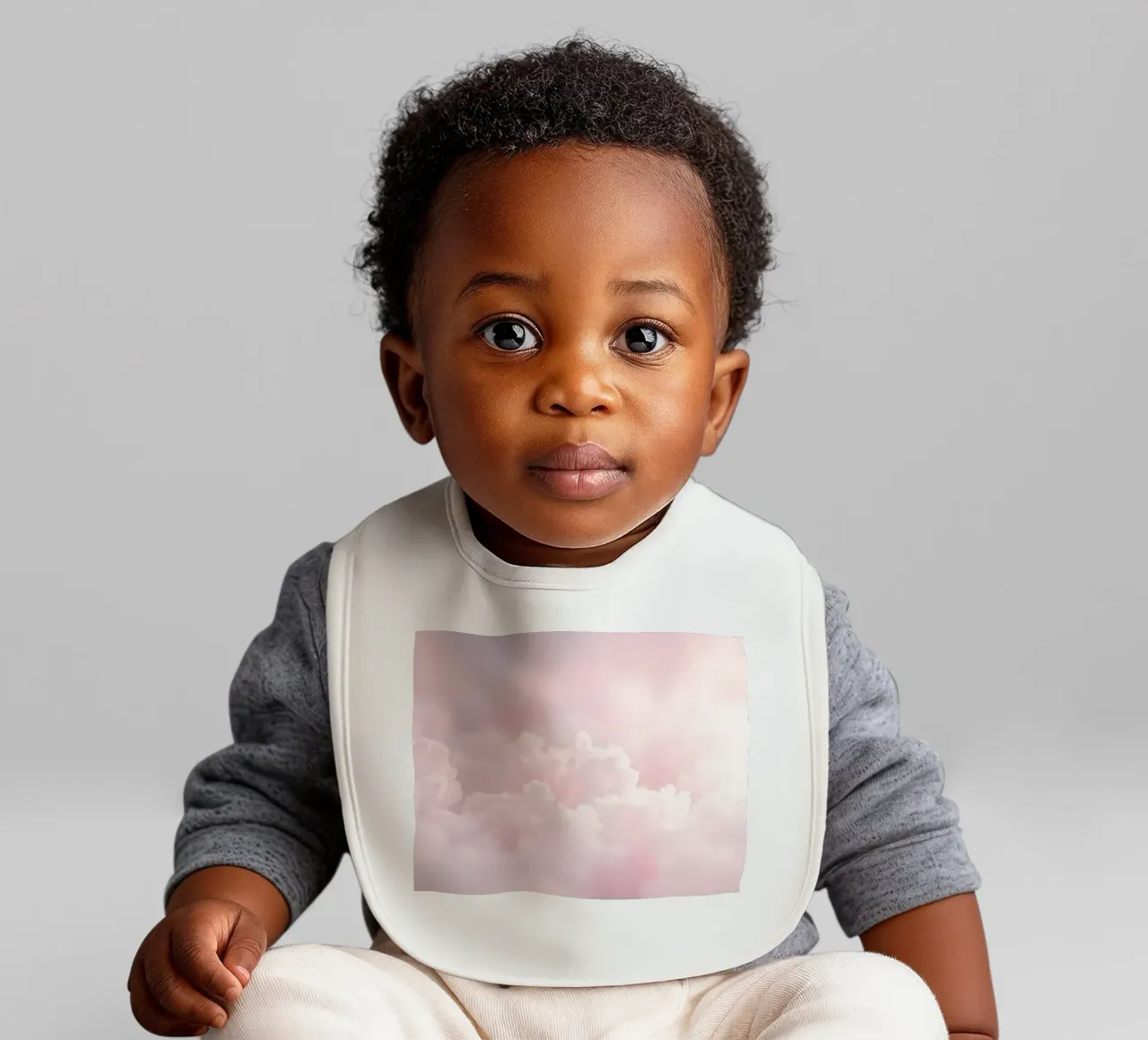 Soft pastel clouds create a serene abstract background baby bib by DesignDoodle