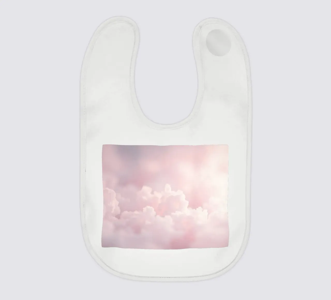 Soft pastel clouds create a serene abstract background baby bib by DesignDoodle
