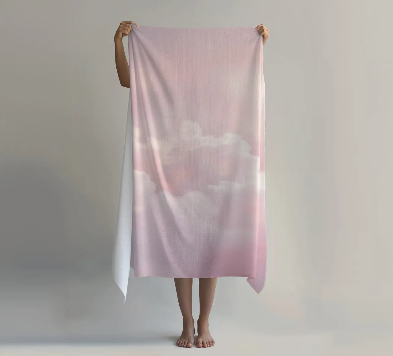 Soft pastel clouds create a serene abstract background beach towel by DesignDoodle
