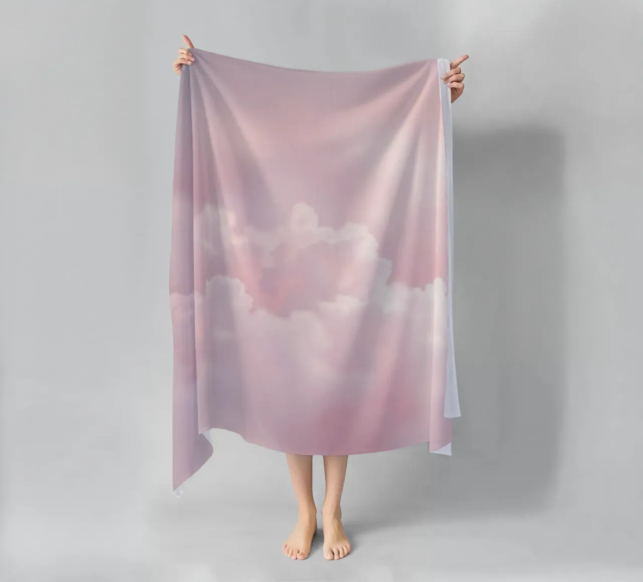 Soft pastel clouds create a serene abstract background beach towel by DesignDoodle