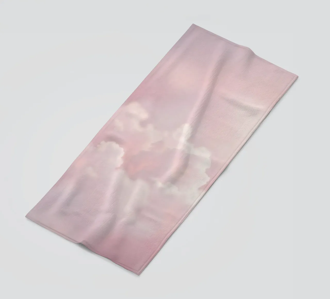 Soft pastel clouds create a serene abstract background beach towel by DesignDoodle