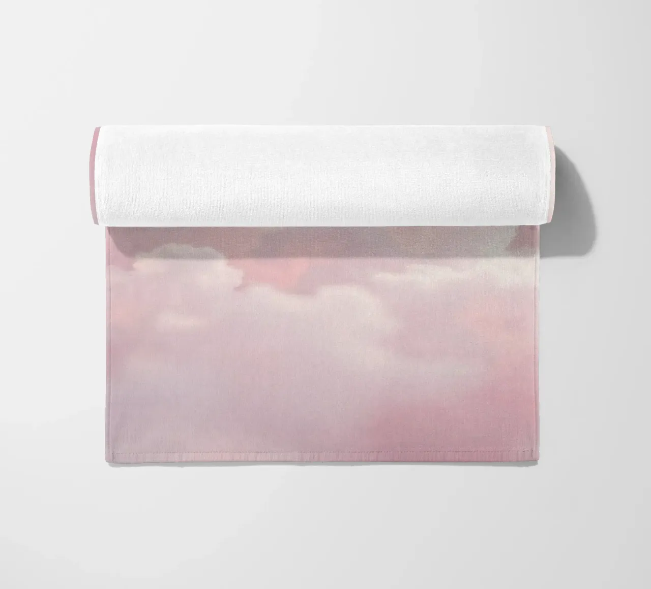 Soft pastel clouds create a serene abstract background beach towel by DesignDoodle