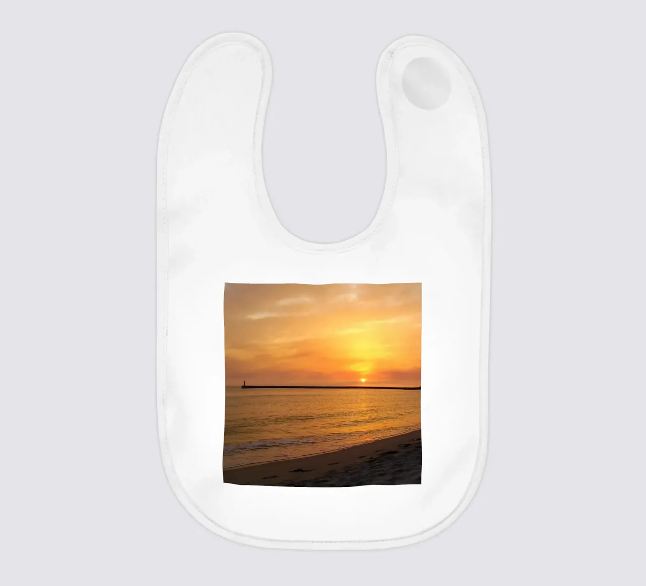 Warm sunset baby bib by Teresa André