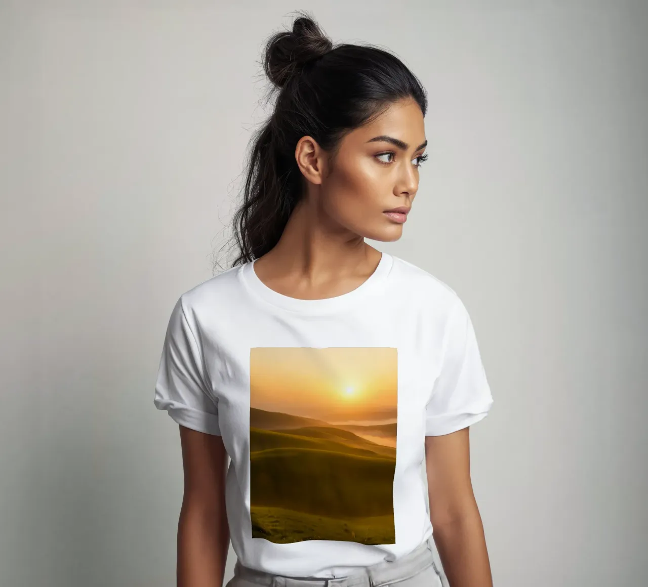 Sunset over rolling green hills with mist creating a serene t-shirt by DesignDoodle