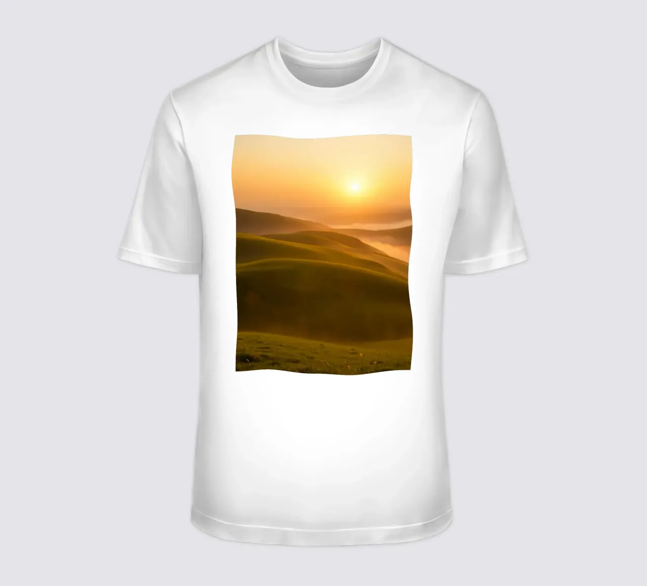 Sunset over rolling green hills with mist creating a serene t-shirt by DesignDoodle