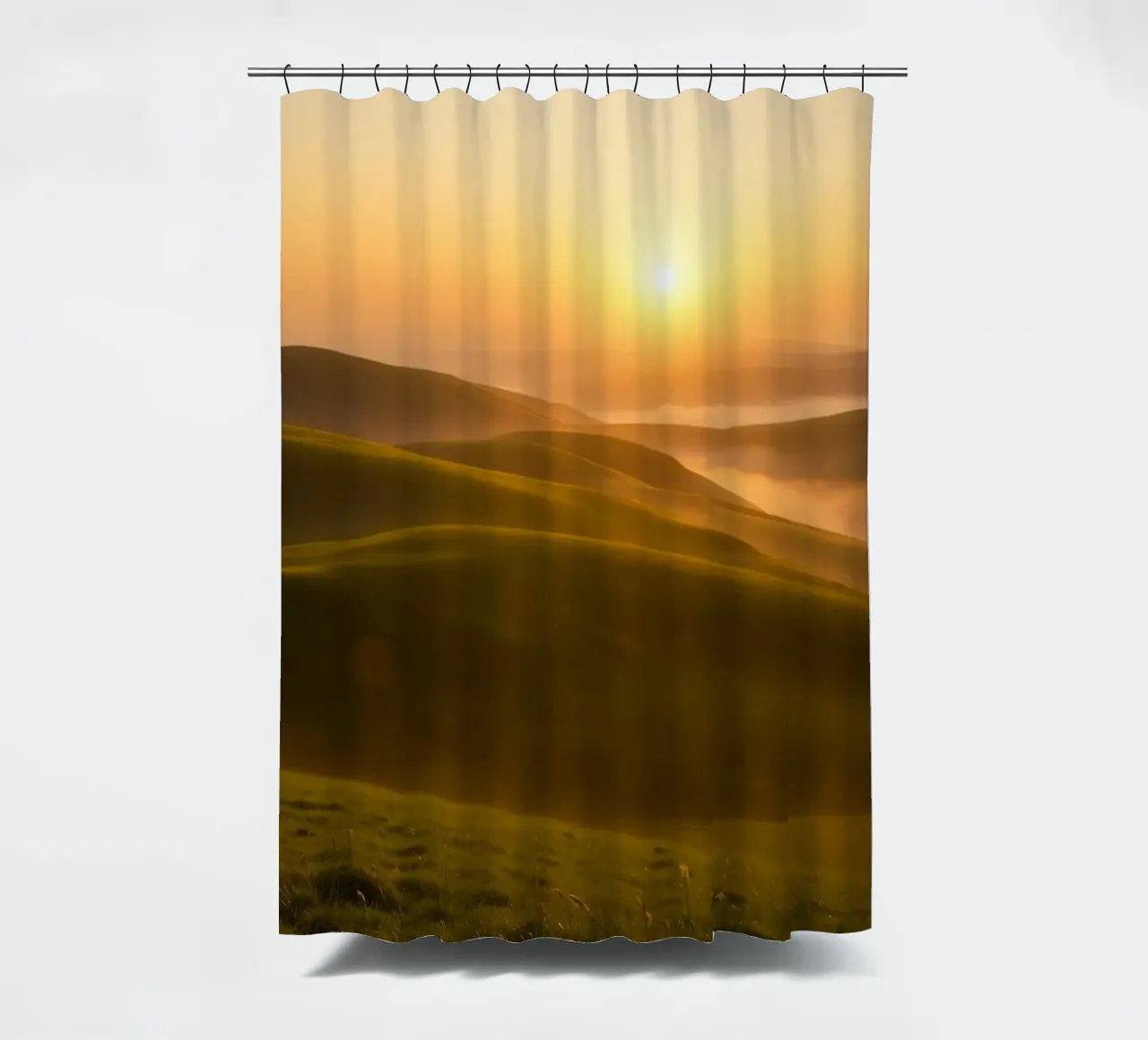 Sunset over rolling green hills with mist creating a serene shower curtain by DesignDoodle