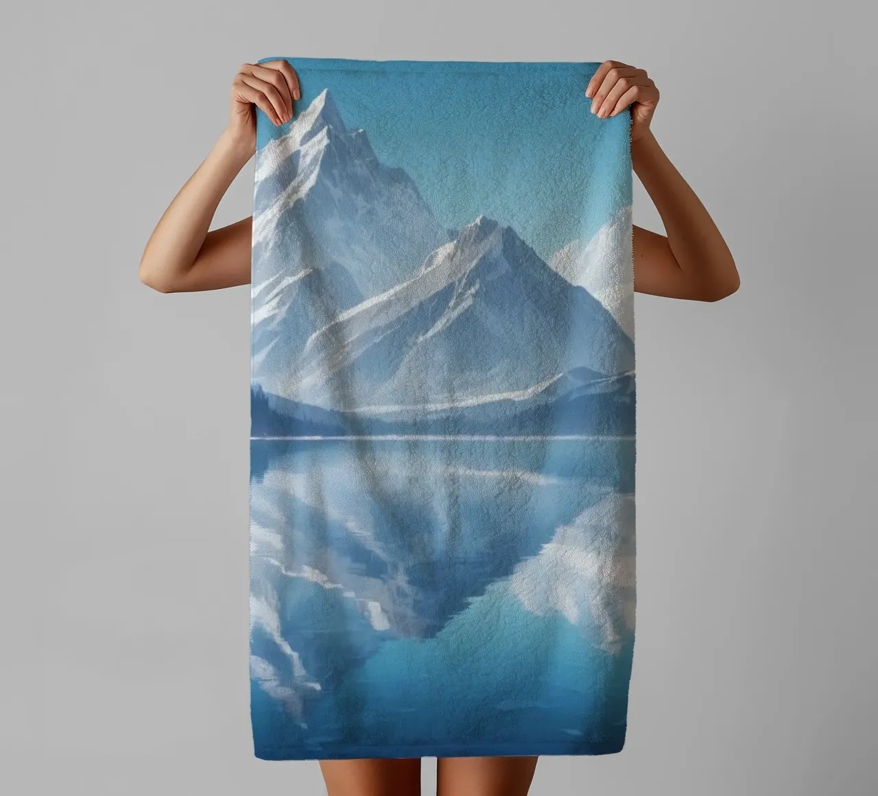 Majestic mountains reflected in a serene lake surrounded towel by DesignDoodle