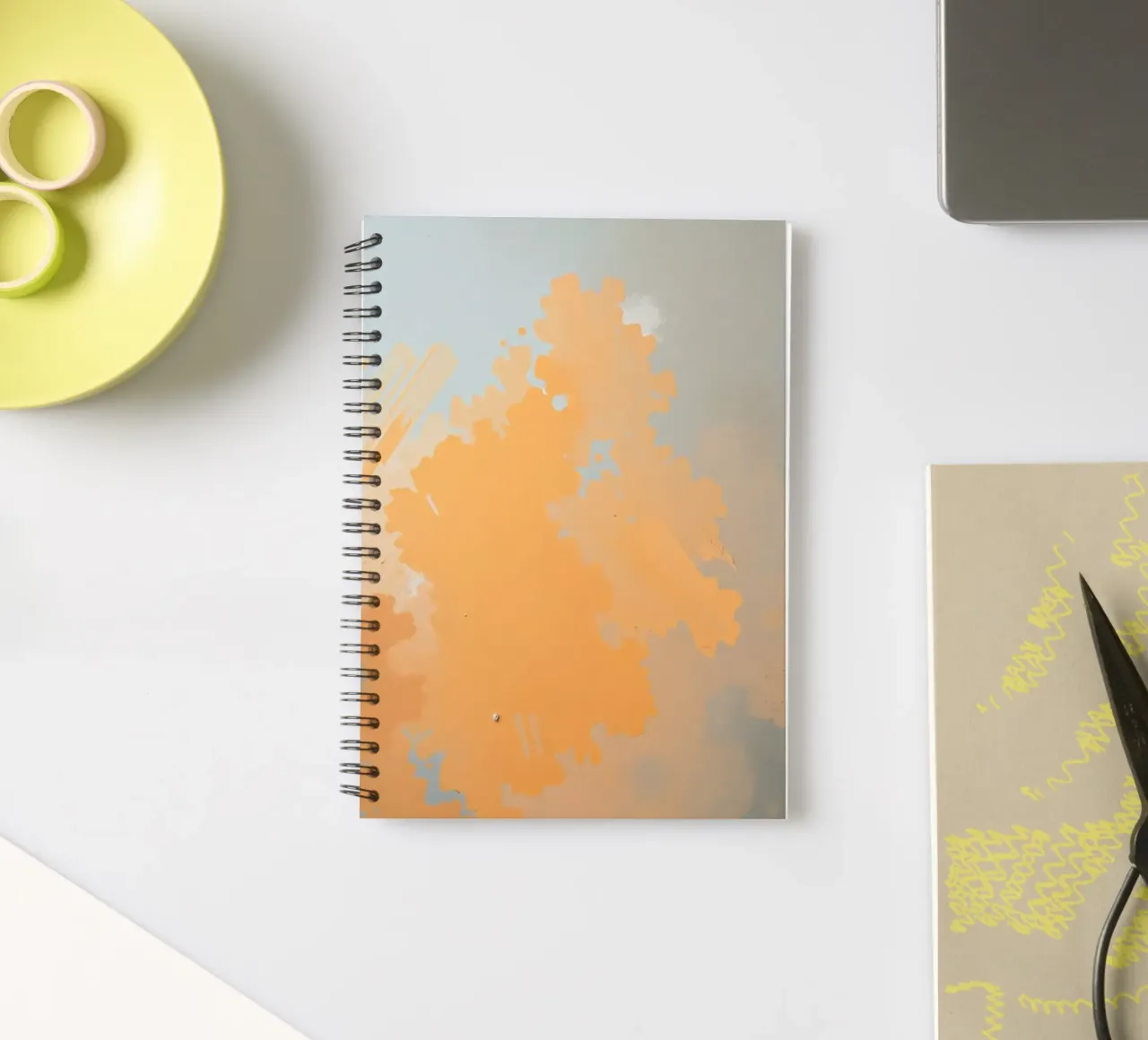 Abstract design featuring soft hues of orange and blue spiral notebook by DesignDoodle